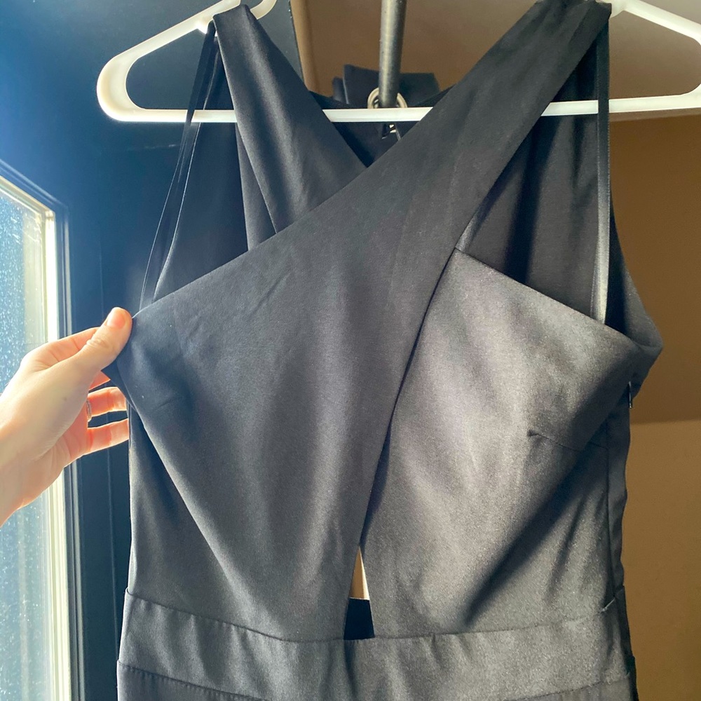 BEBE criss cross front halter black jumpsuit